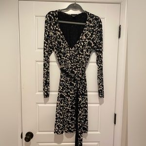 MODA International faux wrap dress.  Black and white print   Attached tie belt.